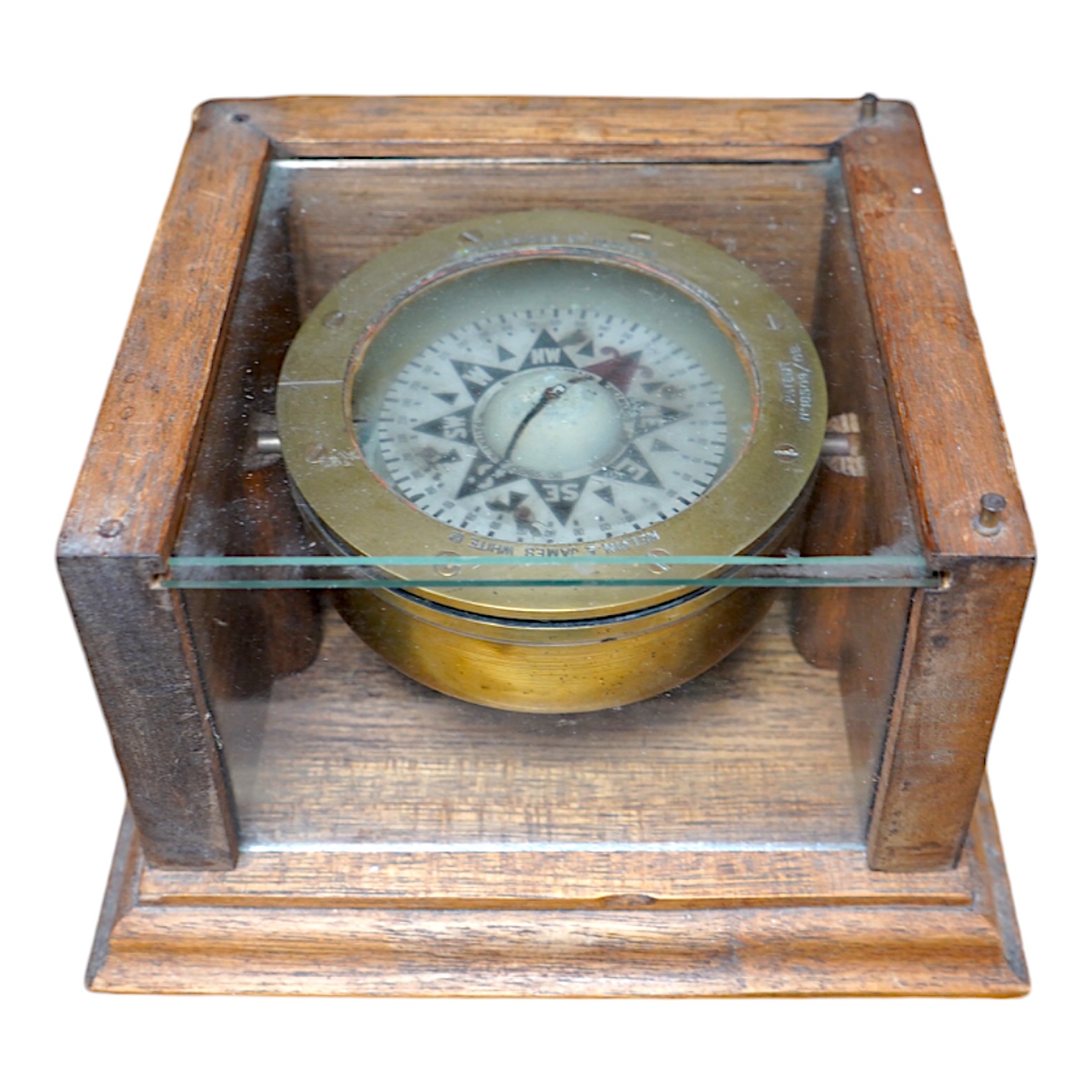 A ‘Kelvin & James White Ltd. 18 Cambridge St. Glasgow’ ship's compass, in a later oak case, 13cm high, 21cm wide, 19cm deep. Condition - poor to fair.